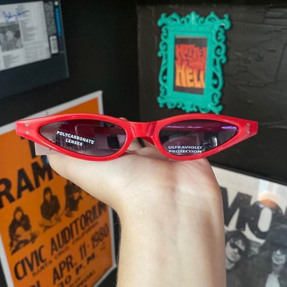 Skinny 1990s style red sunglasses